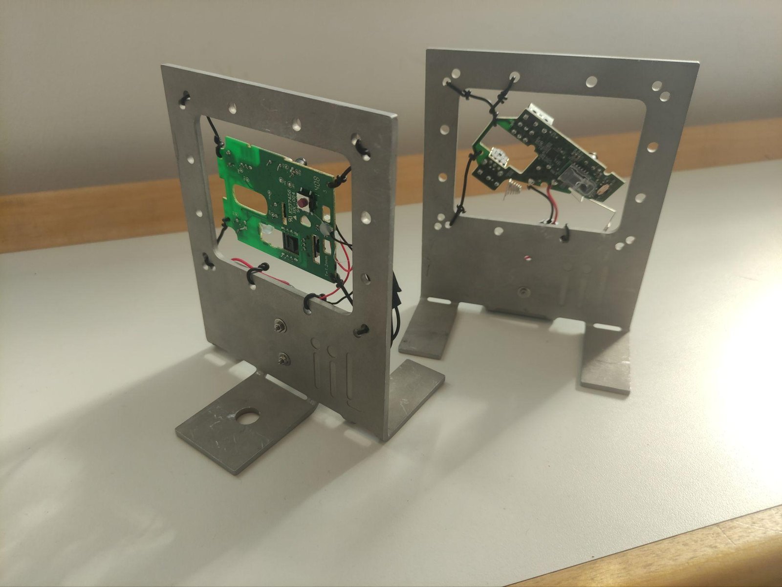 Circuit boards from wireless mice mounted in aluminium frames